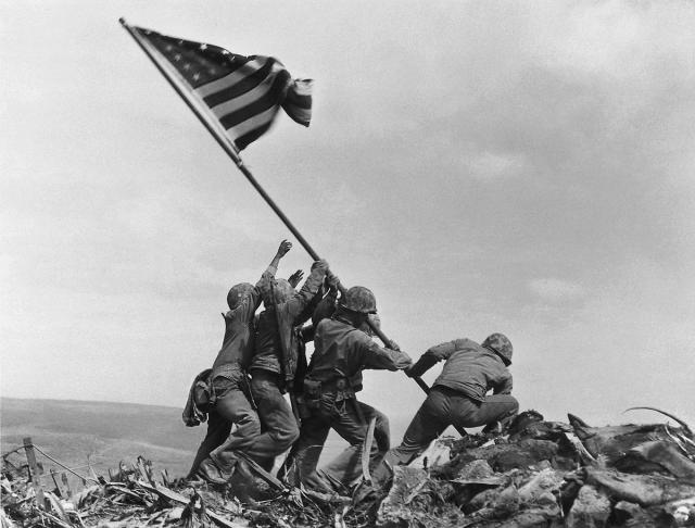 us marines 28th regiment of fifth division raise flag atop mt suribachi iwo jima costliest in marine corps history 7k soldiers killed 36 days fighting